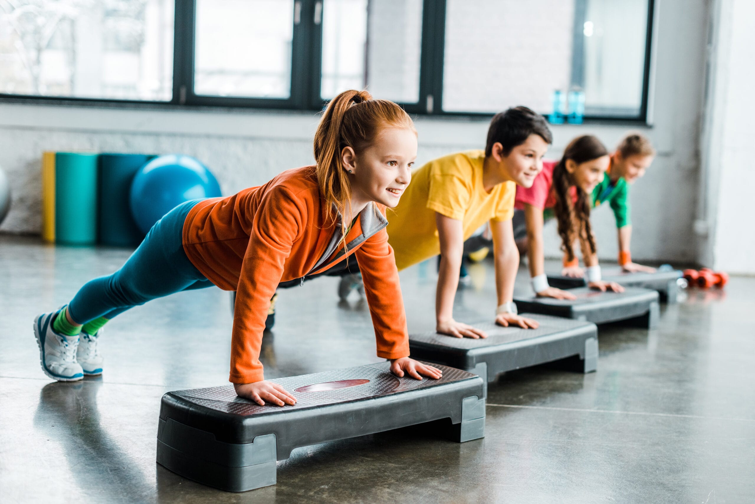 Children doing plank exercise with step platforms - Lakeshore Sport \u0026 Fitness